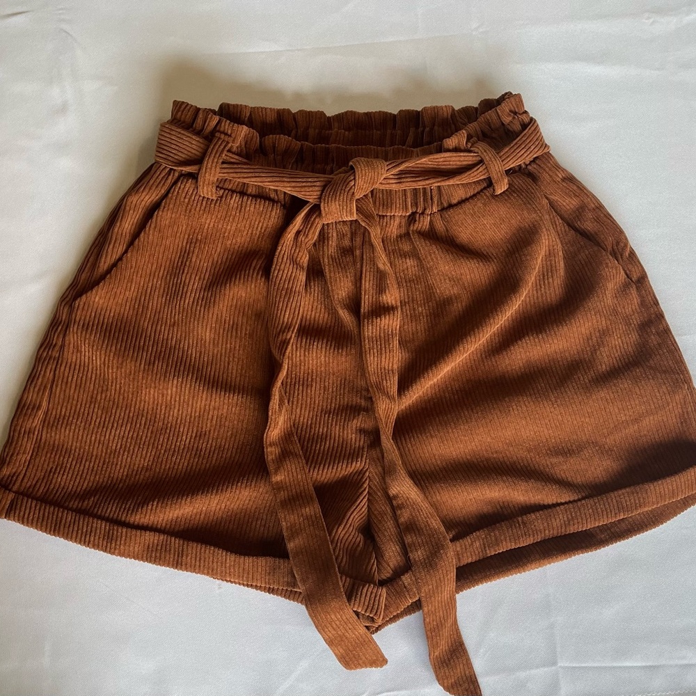 Orange/brown paper bag corduroy shorts in good condition.